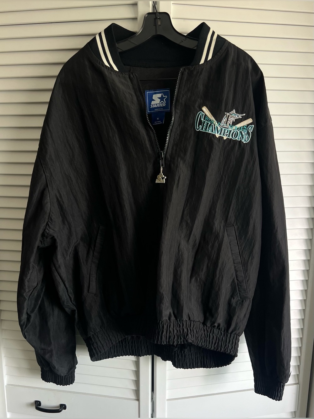 Vintage Champions 1990s Florida Marlins black Starter windbreaker’s jacket.